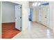 Bright entryway with tile flooring and white door with sidelights at 16299 Sw 14Th Avenue Rd, Ocala, FL 34473