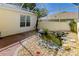 Picturesque fish pond in the backyard, surrounded by rocks and lush plants at 16299 Sw 14Th Avenue Rd, Ocala, FL 34473