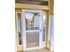 Close-up of front door with sidelights, providing a welcoming entrance at 16299 Sw 14Th Avenue Rd, Ocala, FL 34473