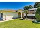 Charming home with inviting front entryway, well-manicured lawn and lush landscaping at 16299 Sw 14Th Avenue Rd, Ocala, FL 34473