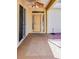 Covered front porch with fan, leading to the main entrance with sidelights at 16299 Sw 14Th Avenue Rd, Ocala, FL 34473