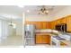 Bright kitchen features wood cabinets, stainless steel appliances, and granite countertops at 16299 Sw 14Th Avenue Rd, Ocala, FL 34473