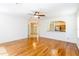 Spacious living room with wood floors, ceiling fan, and open layout at 16299 Sw 14Th Avenue Rd, Ocala, FL 34473