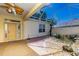 Covered patio with fish pond, creating a serene outdoor space at 16299 Sw 14Th Avenue Rd, Ocala, FL 34473