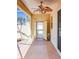 Inviting covered patio with ceiling fan, offering a peaceful outdoor area at 16299 Sw 14Th Avenue Rd, Ocala, FL 34473