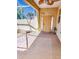 Covered patio area showcasing an adjacent landscaped garden with lush plantings at 16299 Sw 14Th Avenue Rd, Ocala, FL 34473