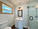 Modern bathroom with a glass-enclosed shower, updated vanity, and contemporary fixtures at 1711 Sw 63Rd St Rd, Ocala, FL 34476