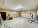 Spacious garage with overhead door, side entrance, and a window for natural light at 1711 Sw 63Rd St Rd, Ocala, FL 34476