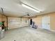 View of garage with work area and door to the house at 1711 Sw 63Rd St Rd, Ocala, FL 34476
