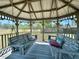 Inviting gazebo interior featuring comfortable swing seating and serene views at 1711 Sw 63Rd St Rd, Ocala, FL 34476