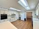 Large kitchen with white appliances and a breakfast bar, great for entertaining at 1711 Sw 63Rd St Rd, Ocala, FL 34476