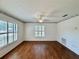 Sunlit room with wood floors and multiple windows for natural light at 1711 Sw 63Rd St Rd, Ocala, FL 34476