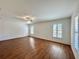 The living room features wood look floors, lots of natural light, and white trim windows at 1711 Sw 63Rd St Rd, Ocala, FL 34476