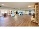 Spacious, open concept floorplan with arched entryways and wood-look flooring at 1711 Sw 63Rd St Rd, Ocala, FL 34476