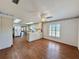 Open living room area with plenty of natural light and wood-look flooring at 1711 Sw 63Rd St Rd, Ocala, FL 34476