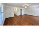 Spacious living room with wood floors, ceiling fan, and neutral walls at 1711 Sw 63Rd St Rd, Ocala, FL 34476