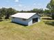 Exterior view of garage or outbuilding with metal roof at 1711 Sw 63Rd St Rd, Ocala, FL 34476