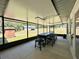 Enclosed patio with exterior view of backyard and adjacent structure at 1711 Sw 63Rd St Rd, Ocala, FL 34476