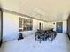 Enclosed patio with table and chairs with view to yard at 1711 Sw 63Rd St Rd, Ocala, FL 34476