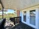 Covered porch with double doors leads to a lovely landscaped yard at 1711 Sw 63Rd St Rd, Ocala, FL 34476