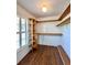 Walk-in closet with built-in shelves and natural light from the window at 1711 Sw 63Rd St Rd, Ocala, FL 34476