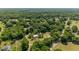 Picturesque aerial view of a home nestled among lush trees, in a serene, countryside setting at 18695 Ne 5Th Terrace Rd, Citra, FL 32113