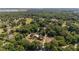 Serene aerial view showcasing a home nestled among lush trees, with surrounding countryside at 18695 Ne 5Th Terrace Rd, Citra, FL 32113