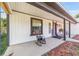 Charming covered front porch featuring a rocking chair and inviting entrance to the home at 18695 Ne 5Th Terrace Rd, Citra, FL 32113