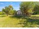 Picturesque home with meticulous landscaping and mature trees, offering a serene and inviting curb appeal at 18695 Ne 5Th Terrace Rd, Citra, FL 32113