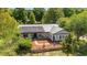 Beautiful home featuring solar panels, a metal roof, and meticulously landscaped grounds, blending comfort and efficiency at 18695 Ne 5Th Terrace Rd, Citra, FL 32113