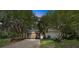 Unique garage with vibrant blue and yellow doors, offering ample space and character in a serene setting at 18695 Ne 5Th Terrace Rd, Citra, FL 32113