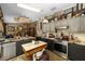 Spacious kitchen with stainless steel appliances, an island with seating and rustic decor at 18695 Ne 5Th Terrace Rd, Citra, FL 32113
