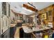 Rustic kitchen with distressed cabinets, unique island and stainless steel appliances at 18695 Ne 5Th Terrace Rd, Citra, FL 32113