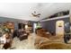 Living area featuring comfortable seating, ceiling fan, and fish aquarium at 18695 Ne 5Th Terrace Rd, Citra, FL 32113