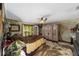 Spacious main bedroom features eclectic decor, lots of sunlight and an antique wardrobe at 18695 Ne 5Th Terrace Rd, Citra, FL 32113