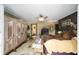 A main bedroom boasts an antique wardrobe, ceiling fan, and ensuite bathroom at 18695 Ne 5Th Terrace Rd, Citra, FL 32113