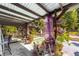 Relaxing outdoor space featuring a pool, pergola with plants, and eclectic decor, perfect for entertaining at 18695 Ne 5Th Terrace Rd, Citra, FL 32113