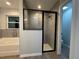 Bathroom featuring a shower, soaking tub, and modern tile at 203 Locust Pass, Ocala, FL 34472