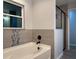 Bathroom with a soaking tub, tiled walls, and a glass shower at 203 Locust Pass, Ocala, FL 34472