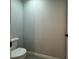 Bright half bathroom features neutral wall paint and tile floors at 203 Locust Pass, Ocala, FL 34472