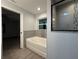 Modern bathroom featuring a bathtub and shower at 203 Locust Pass, Ocala, FL 34472
