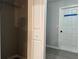 Walk-in closet with wire shelving, next to a door at 203 Locust Pass, Ocala, FL 34472