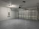 Spacious garage with sealed floors, garage door and opener at 203 Locust Pass, Ocala, FL 34472