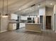Modern kitchen with stainless steel appliances, white cabinets, and a center island at 203 Locust Pass, Ocala, FL 34472
