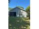 View of the home's backyard with a screened in porch at 2127 N.E. 40Th Ave., Ocala, FL 34470