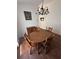 Cozy dining room featuring wood floors, classic light fixture and table for four at 2127 N.E. 40Th Ave., Ocala, FL 34470