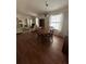 Open-concept dining room with hardwood floors and natural light, perfect for Gathering gatherings and entertaining guests at 2127 N.E. 40Th Ave., Ocala, FL 34470