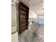 Garage featuring built-in shelving, a bookcase, and a large storage area for vehicles and equipment at 2127 N.E. 40Th Ave., Ocala, FL 34470