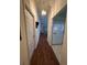 Long hallway leads to the kitchen and living area with seamless flooring at 2127 N.E. 40Th Ave., Ocala, FL 34470