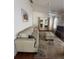 Bright living room boasts vaulted ceilings, ceiling fan, and sliding glass doors at 2127 N.E. 40Th Ave., Ocala, FL 34470